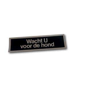 STICKER 165X45 ZWART/ZILVER TEKST "WACHT U VOOR DE HOND"